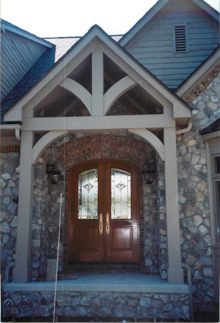 A front door of a house with two doors.