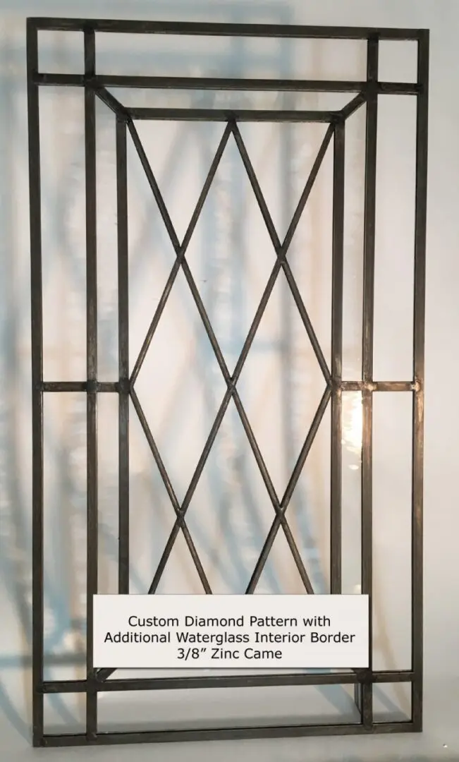 Metal frame with a custom diamond pattern design and waterglass interior border. Label reads: "Custom Diamond Pattern with Additional Waterglass Interior Border 3/8" Zinc Came.